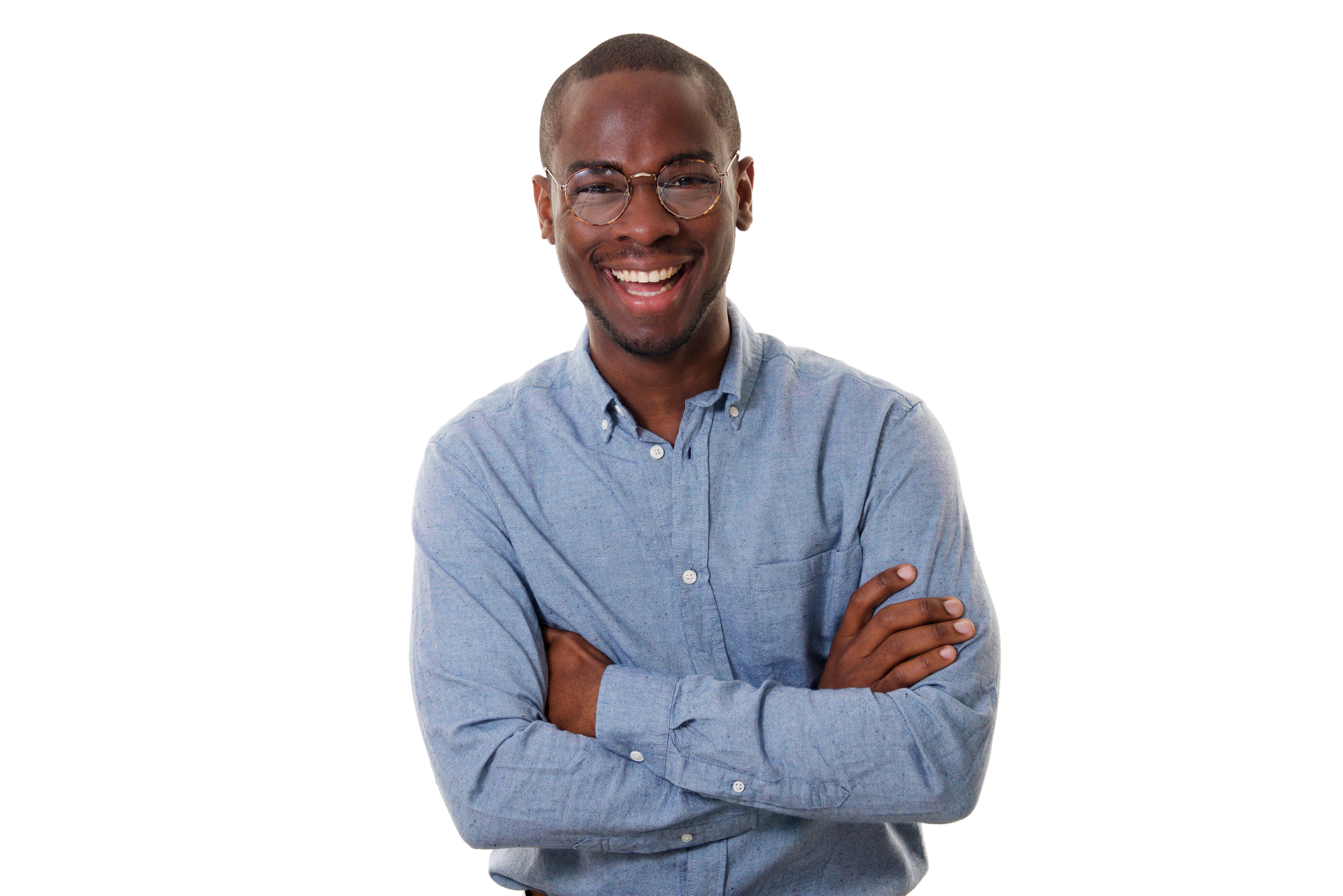 man smiling with his arms crossed